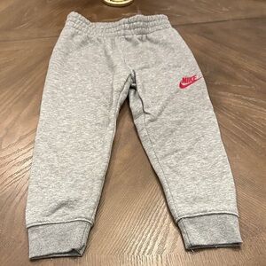 Nike Kids Gray Joggers with Red Logo